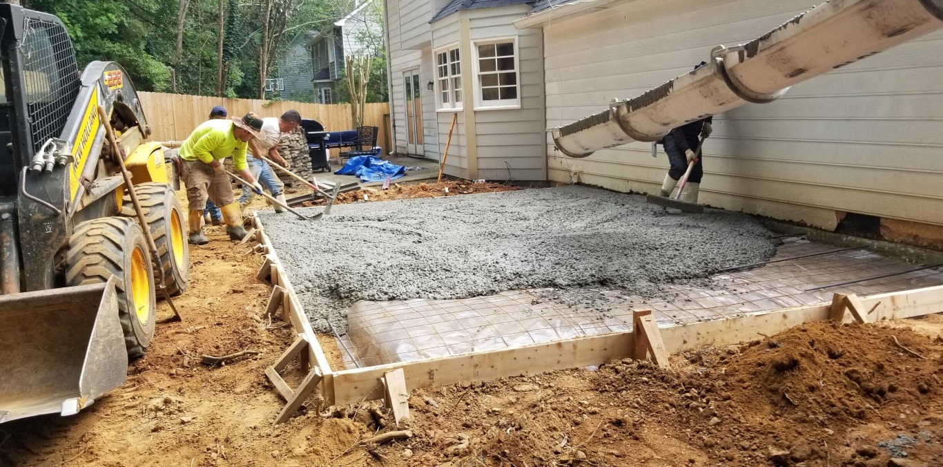 Professional concrete base preparation for driveway extension in Freeport, NY