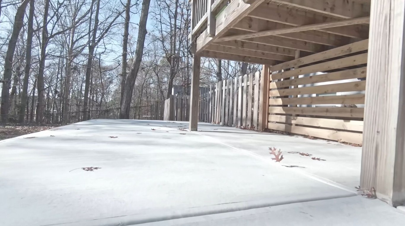 Durable concrete patio under deck requiring minimal maintenance