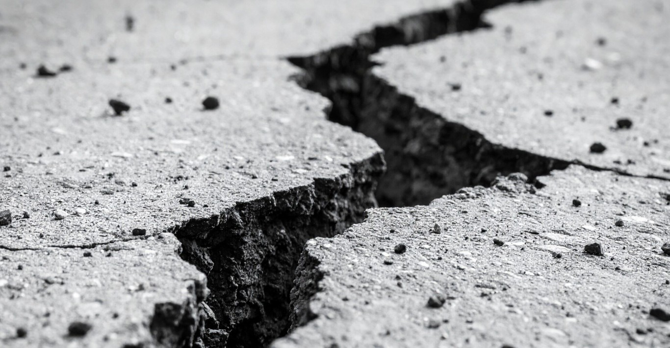 Damaged cracked concrete requiring professional repair services